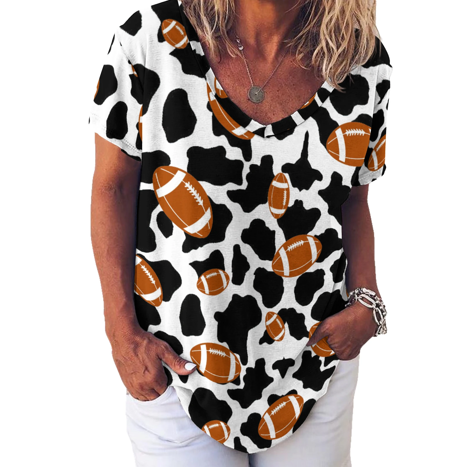 Women's V-Neck Short Sleeve Tee in Footballs And Cow Spots print – front torso view