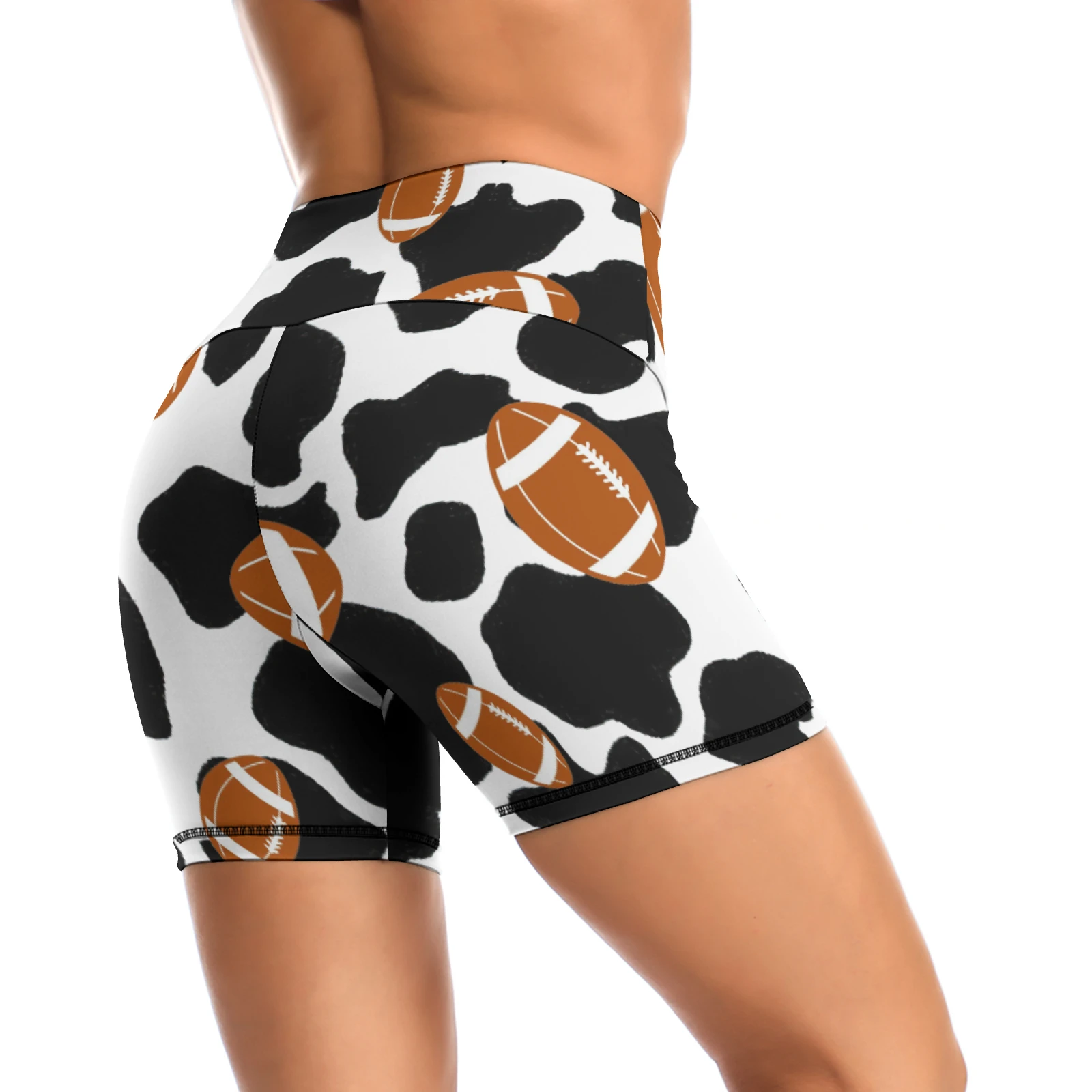 Women's High-Waist Yoga Shorts in Footballs And Cow Spots print – rear three-quarter view