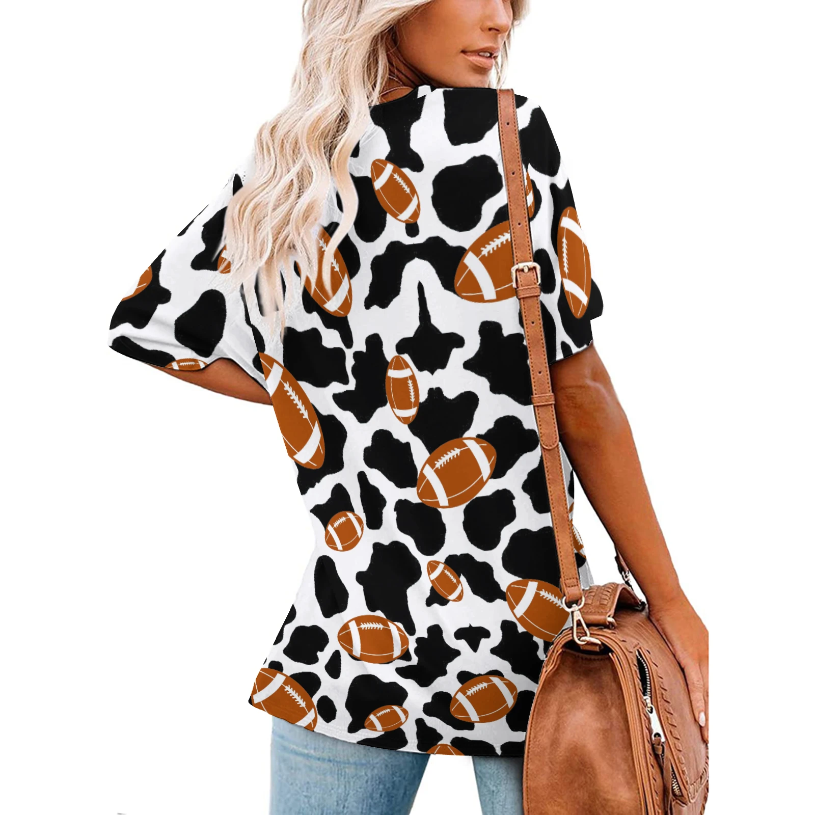 Women's V-Neck Short Sleeve Tee in Footballs And Cow Spots print – back view on model