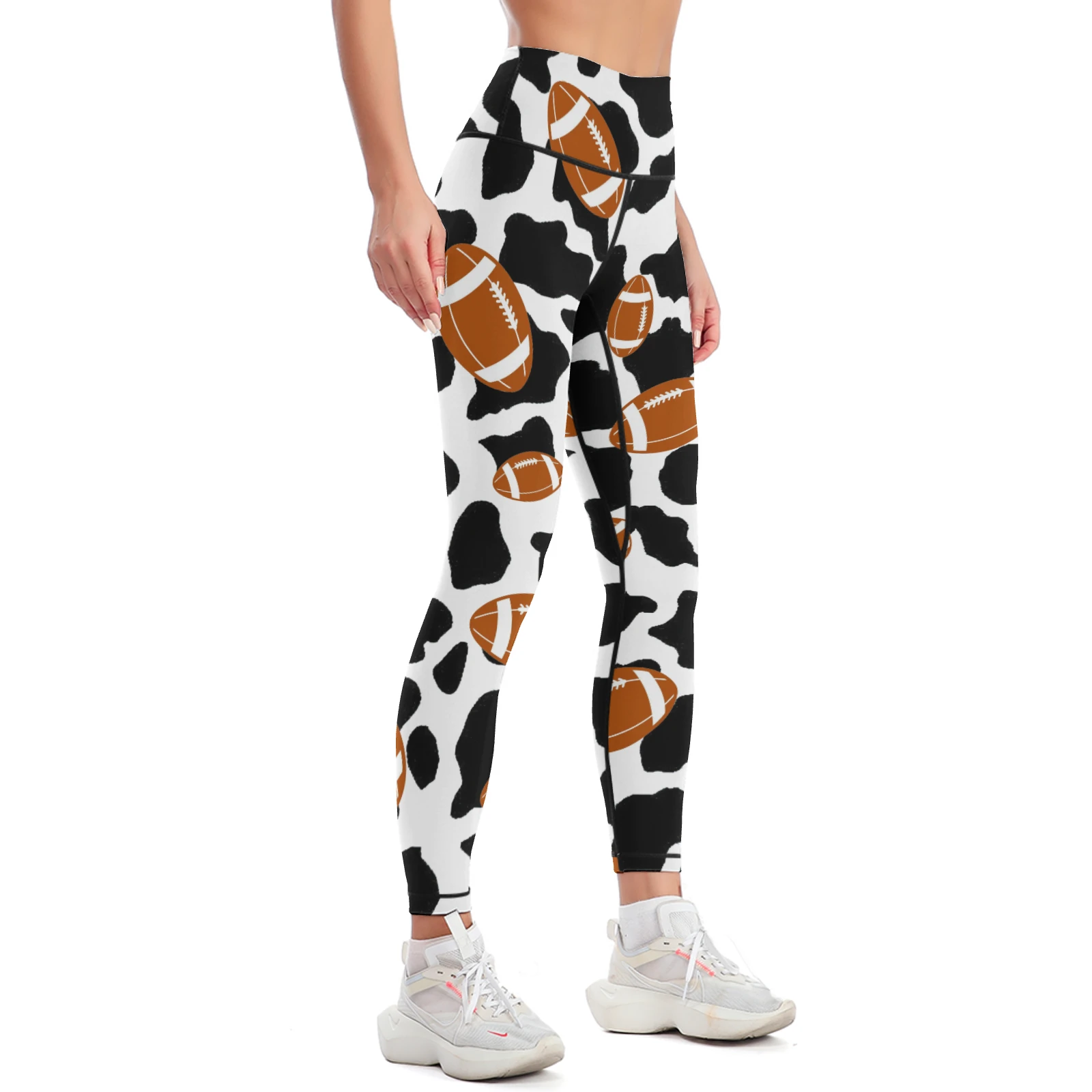 Women's High-Waist Yoga Leggings in Footballs And Cow Spots print – front three-quarter view