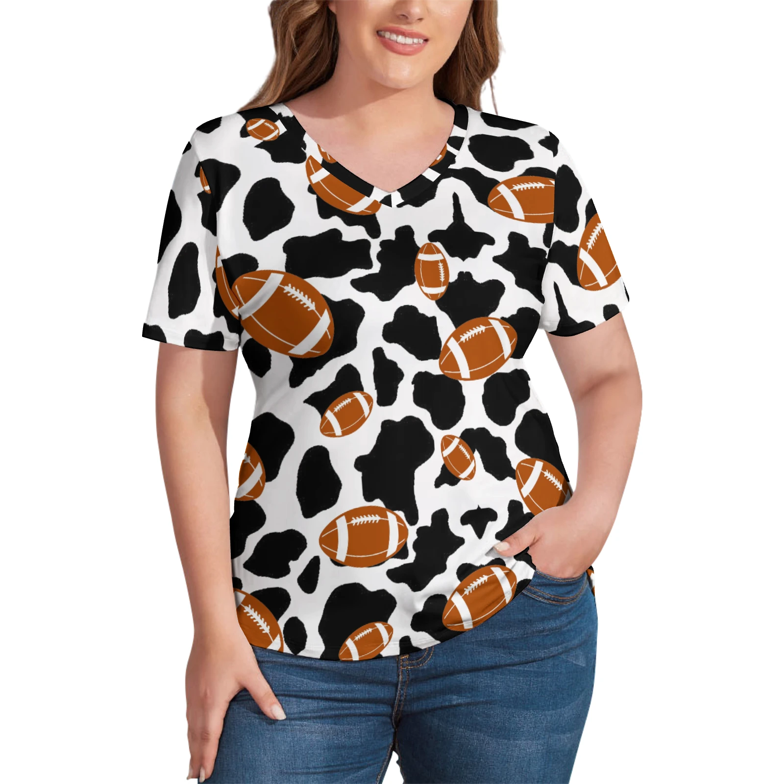 Women's V-Neck Short Sleeve Tee in Footballs And Cow Spots print – front view on model