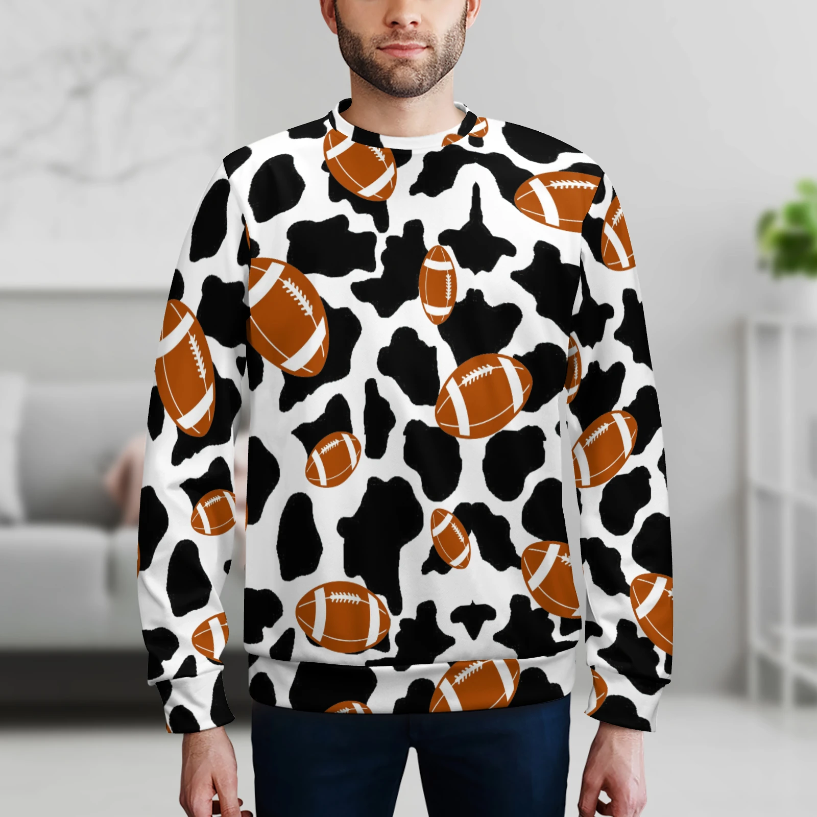 Men's Crew Neck Sweatshirt in Footballs And Cow Spots print – indoor lifestyle shot