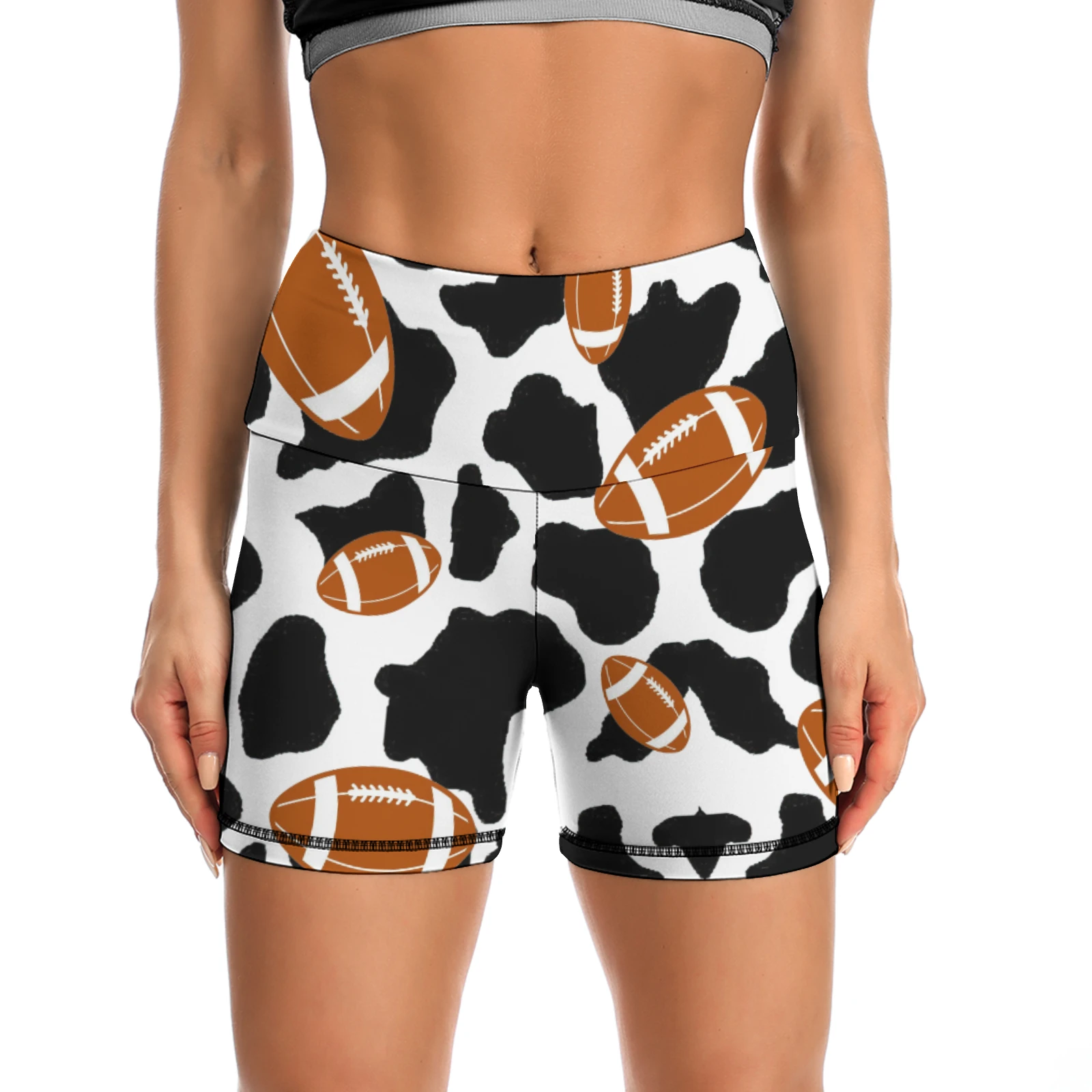 Women's High-Waist Yoga Shorts in Footballs And Cow Spots print – front view