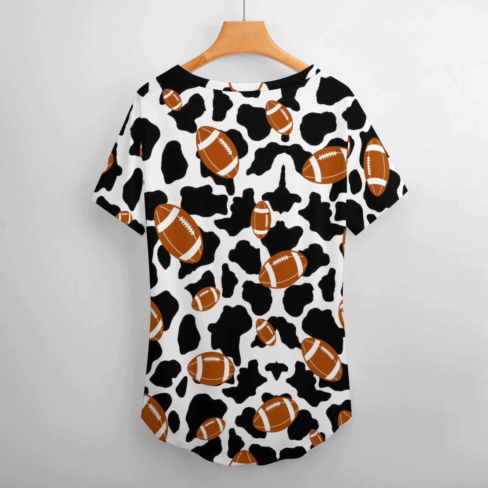 Women's V-Neck Short Sleeve Tee in Footballs And Cow Spots print – back view on hanger