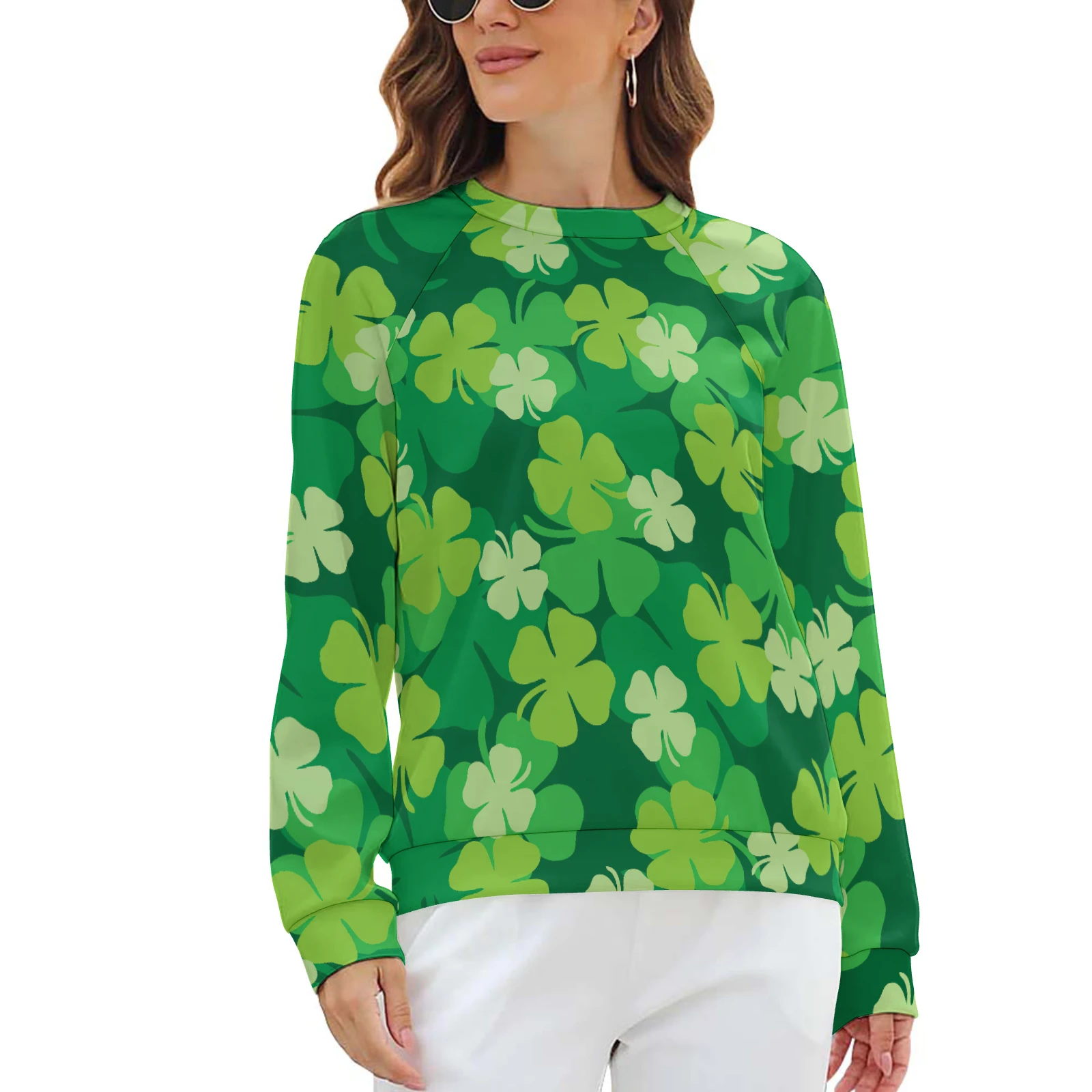 Women's Raglan Crew Neck Sweatshirt in Green Clover Scatter print – model with white pants