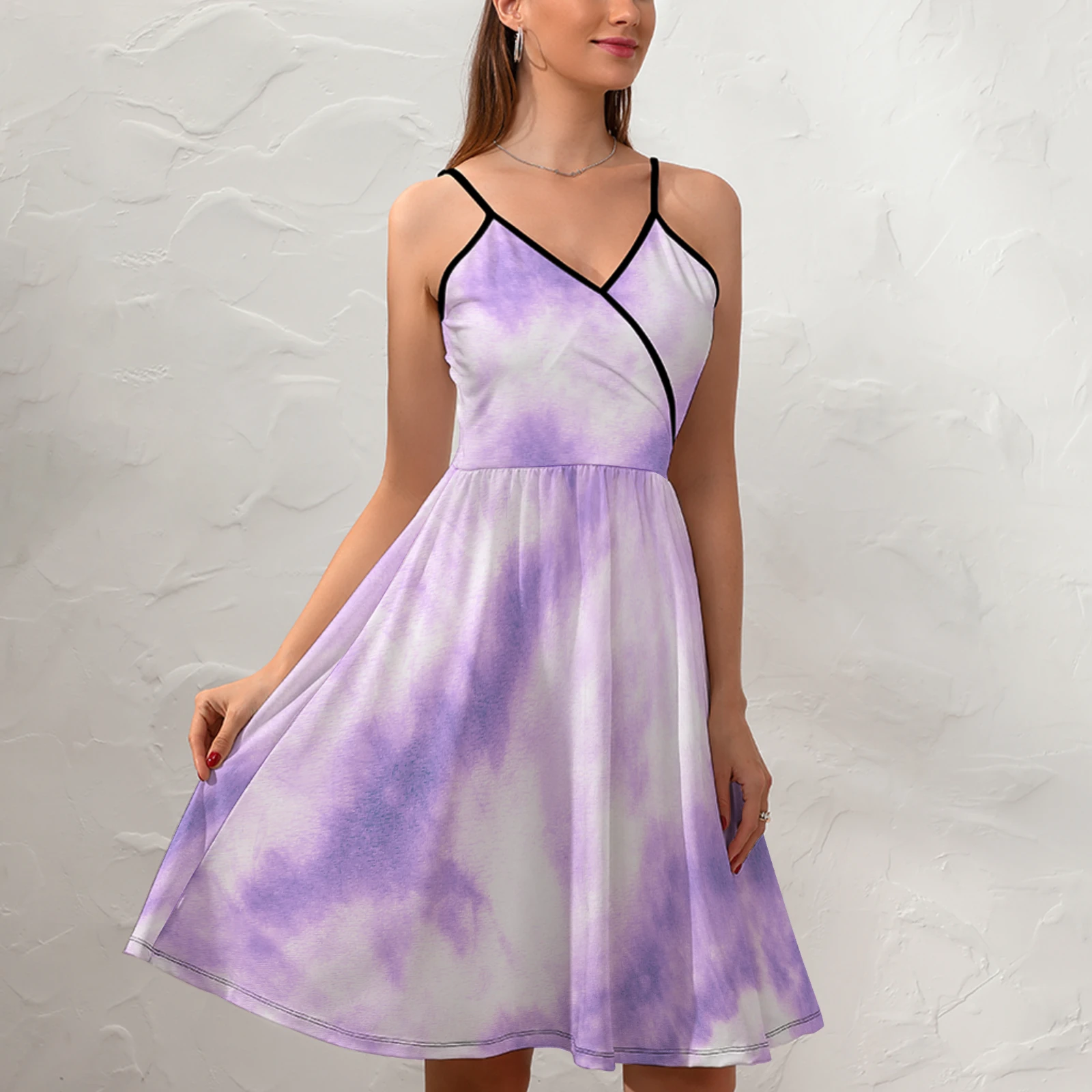 Women's V-Neck Cami Skater Dress in Lavender Tie-Dye print – front view on model against a textured wall